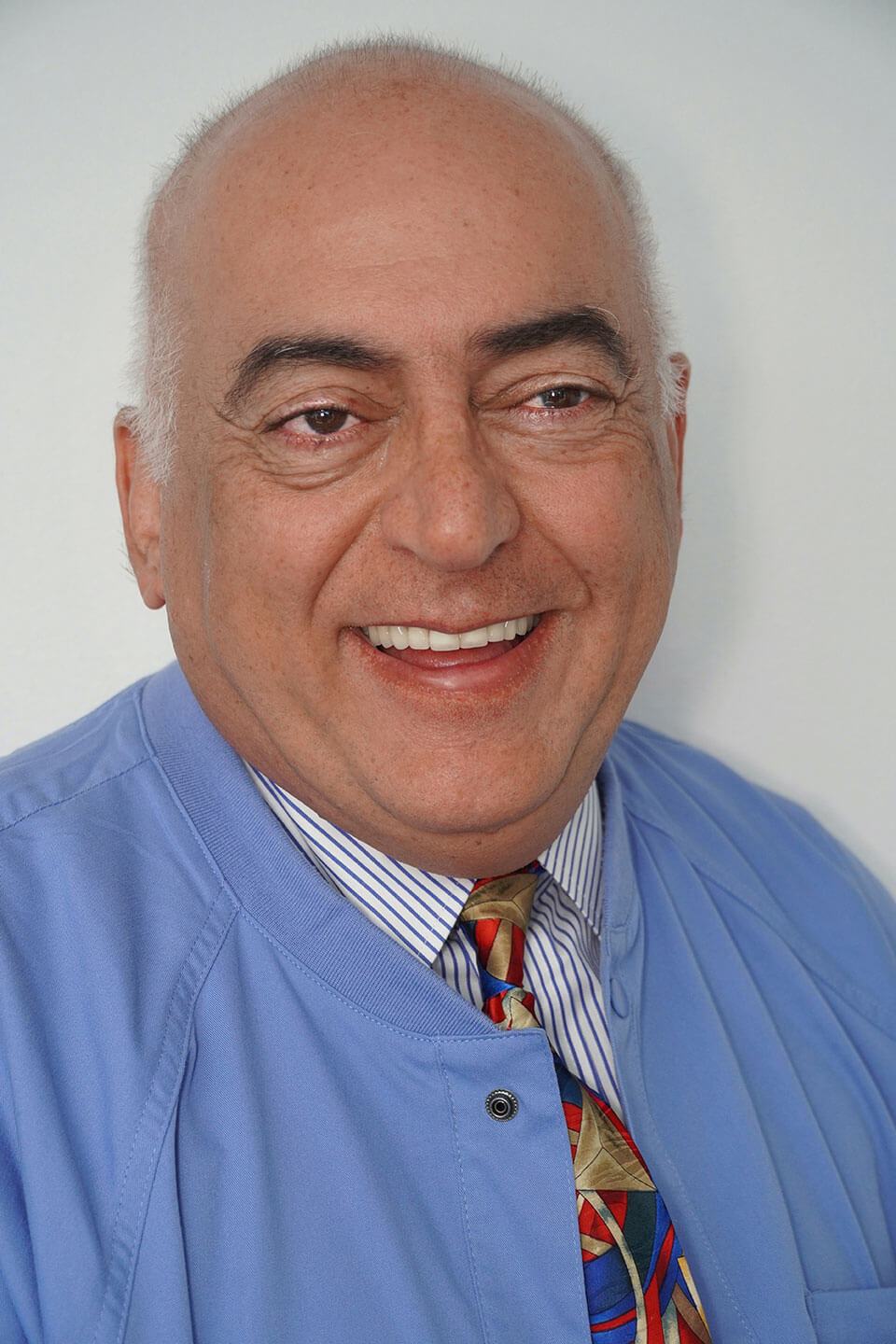 A smiling photo of Dr. Khattab