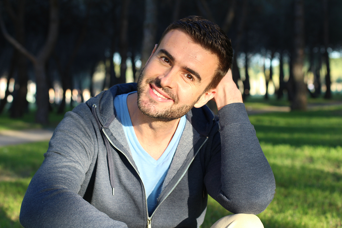 Handsome man smiling in the park